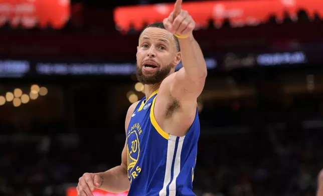 Golden State Warriors guard Stephen Curry (30) reacts in the second half of an NBA basketball game against the Memphis Grizzlies Tuesday, April 1, 2025, in Memphis, Tenn. (AP Photo/Brandon Dill)