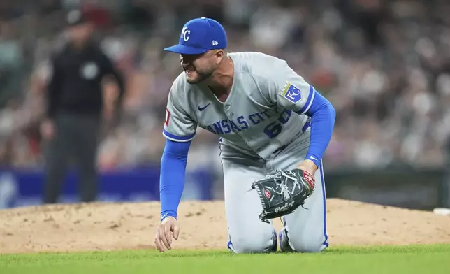 Kansas City Royals pitcher Lucas Erceg grimaces after falling to the ground after being hit by a Detroit Tigers' Riley Greene line drive in the seventh inning during a baseball game, Friday, April 18, 2025, in Detroit. (AP Photo/Paul Sancya)