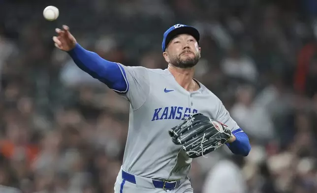 Kansas City Royals pitcher Lucas Erceg throws to first base for an out on Detroit Tigers' Gleyber Torres in the seventh inning during a baseball game, Friday, April 18, 2025, in Detroit. (AP Photo/Paul Sancya)