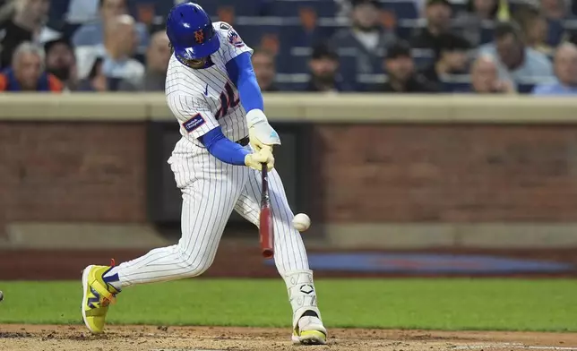 New York Mets' Francisco Lindor hits a two-run home run during the second inning of a baseball game against the Arizona Diamondbacks Tuesday, April 29, 2025, in New York. (AP Photo/Frank Franklin II)
