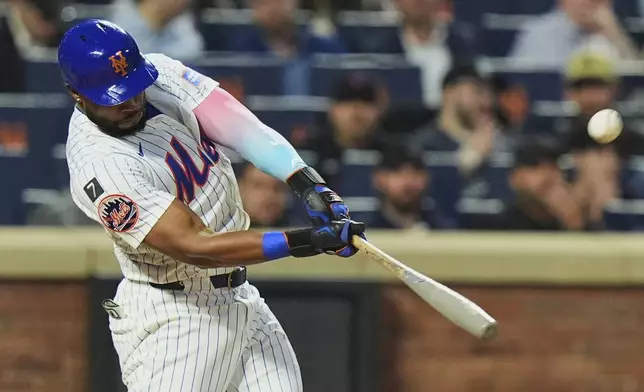 New York Mets' Starling Marte hits a two-run home run during the third inning of a baseball game against the Arizona Diamondbacks Tuesday, April 29, 2025, in New York. (AP Photo/Frank Franklin II)