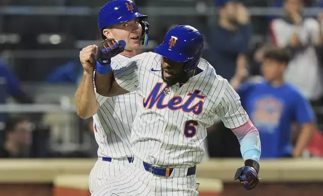 New York Mets' Starling Marte, right, celebrates with Pete Alonso after they scored on a two-run home run during the third inning of a baseball game against the Arizona Diamondbacks Tuesday, April 29, 2025, in New York. (AP Photo/Frank Franklin II)