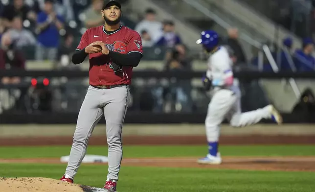 Arizona Diamondbacks pitcher Eduardo Rodriguez reacts as New York Mets' Starling Marte runs the bases after hitting a two-run home run during the third inning of a baseball game Tuesday, April 29, 2025, in New York. (AP Photo/Frank Franklin II)