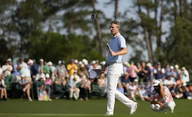 Justin Rose waves after making a putt on the 18th hole during the first round at the Masters golf tournament, Thursday, April 10, 2025, in Augusta, Ga. (AP Photo/David J. Phillip)