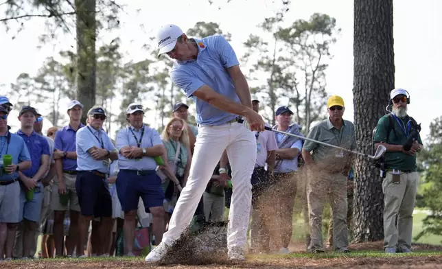 Justin Rose hits from the pine straw on the 15th hole during the first round at the Masters golf tournament, Thursday, April 10, 2025, in Augusta, Ga. (AP Photo/Julia Demaree Nikhinson)