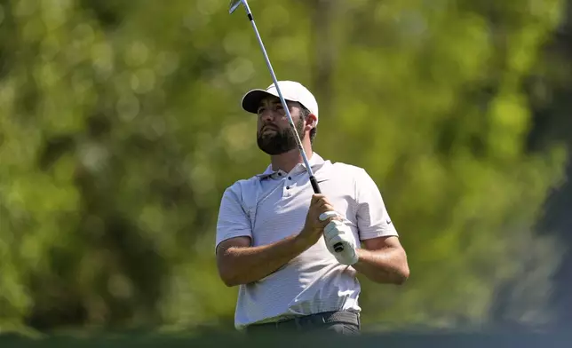 Scottie Scheffler watches his tee shot on the fourth hole during the first round at the Masters golf tournament, Thursday, April 10, 2025, in Augusta, Ga. (AP Photo/David J. Phillip)
