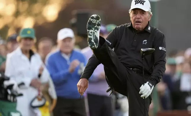 Honorary Starter Gary Player stretches on the first hole during the first round at the Masters golf tournament, Thursday, April 10, 2025, in Augusta, Ga. (AP Photo/David J. Phillip)