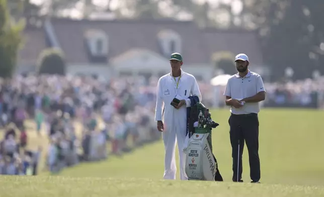 Scottie Scheffler waits to hit on the first hole during the first round at the Masters golf tournament, Thursday, April 10, 2025, in Augusta, Ga. (AP Photo/Ashley Landis)