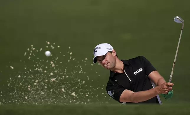 Thomas Detry, of Belgium, hits from the bunker on the second hole during the first round at the Masters golf tournament, Thursday, April 10, 2025, in Augusta, Ga. (AP Photo/George Walker IV)