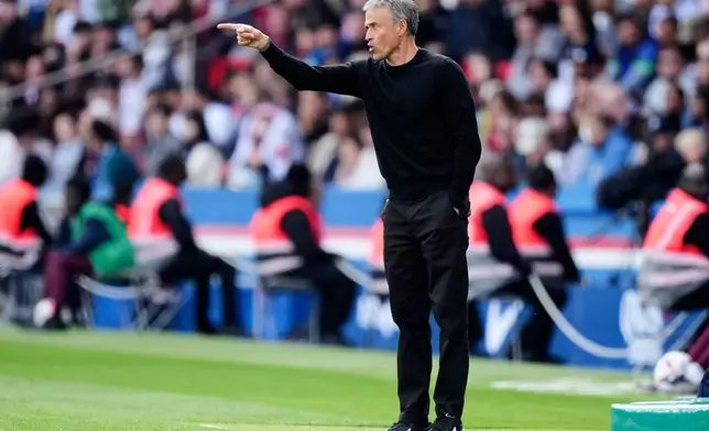 PSG's head coach Luis Enrique gestures during the French League One soccer match between Paris Saint-Germain and Le Havre at the Parc des Princes stadium in Paris, Saturday, April 19, 2025. (AP Photo/Michel Euler)