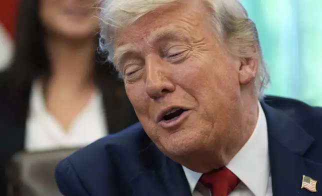 President Donald Trump speaks with reporters after signing executive orders in the Oval Office of the White House, Wednesday, April 23, 2025, in Washington. (AP Photo/Alex Brandon)