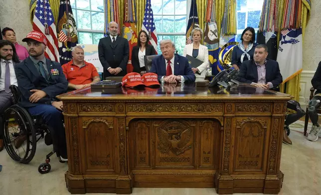 President Donald Trump speaks with reporters after signing executive orders in the Oval Office of the White House, Wednesday, April 23, 2025, in Washington. (AP Photo/Alex Brandon)