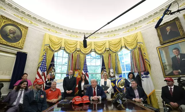 President Donald Trump speaks with reporters after signing executive orders in the Oval Office of the White House, Wednesday, April 23, 2025, in Washington. (AP Photo/Alex Brandon)