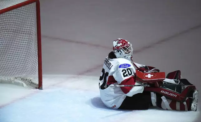 Andrea Braendli of Switzerland sits on ice during the quarterfinal match between Czech Republic and Switzerland at the Women's Ice Hockey Championships in Ceske Budejovice, Czech Republic, Thursday, April 17, 2025. (AP Photo/Petr David Josek)