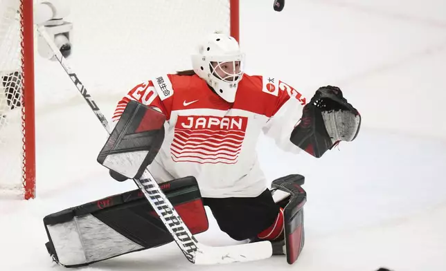 Japan's Miyuu Masuhara fails to make a save during the quarterfinal match between Canada and Japan at the Women's Ice Hockey Championships in Ceske Budejovice, Czech Republic, Thursday, April 17, 2025. (AP Photo/Petr David Josek)