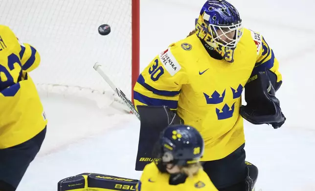 Sweden's Emma Soderberg fails to make a save during the quarterfinal match between Finland and Sweden at the Women's Ice Hockey Championships in Ceske Budejovice, Czech Republic, Thursday, April 17, 2025. (AP Photo/Petr David Josek)