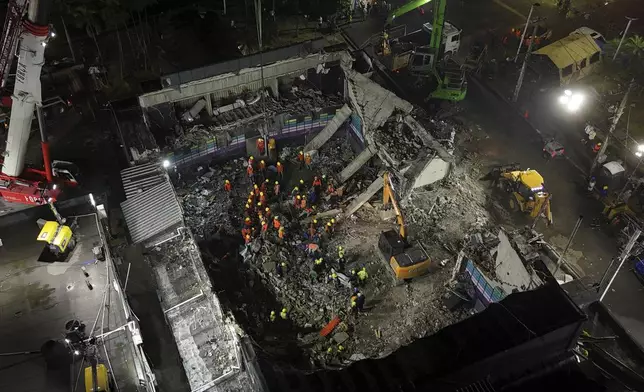 Rescue workers search for bodies at the Jet Set nightclub after its roof collapsed during a merengue concert in Santo Domingo, Dominican Republic, Thursday, April 10, 2025. (AP Photo/Matias Delacroix)