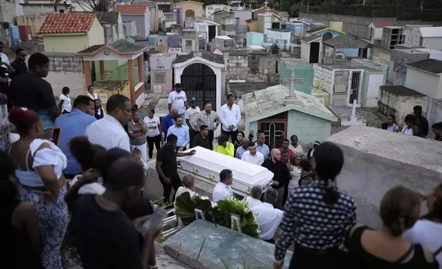 Family and friends attend the funeral of Marilenny Pilarte who died at the Jet Set nightclub when its roof collapsed, in Haina, Dominican Republic, Thursday, April 10, 2025. (AP Photo/Matias Delacroix)