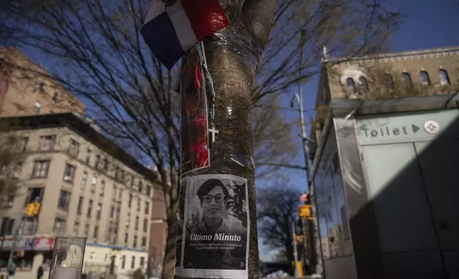 An image of victim Nelsy Cruz, governor of Montecristi, is seen at a makeshift vigil for the victims of the Jet Set club roof collapse, Wednesday, April 9, 2025, in New York. (AP Photo/Adam Gray)