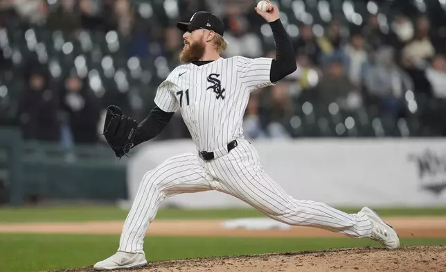 Chicago White Sox pitcher Cam Booser throws against the Boston Red Sox during the seventh inning of a baseball game Friday, April 11, 2025, in Chicago. (AP Photo/Erin Hooley)