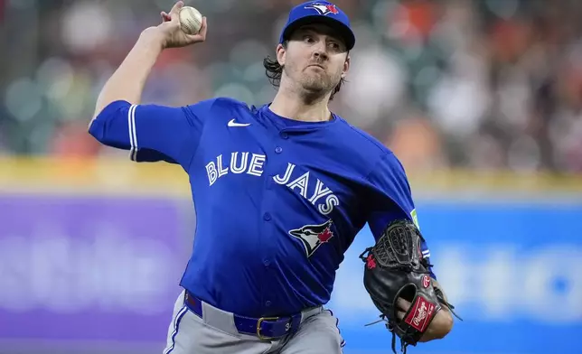 Toronto Blue Jays starting pitcher Kevin Gausman (34) delivers against the Houston Astros during the first inning of a baseball game Monday, April 21, 2025, in Houston. (AP Photo/Eric Christian Smith)