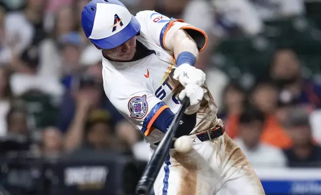 Houston Astros' Zach Dezenzo hits an RBI double against the Toronto Blue Jays during the fifth inning of a baseball game Monday, April 21, 2025, in Houston. (AP Photo/Eric Christian Smith)