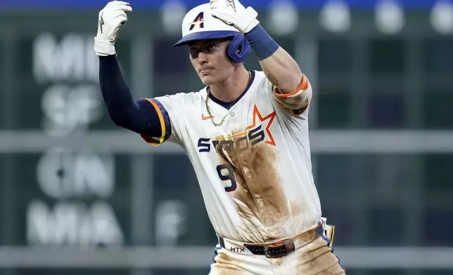 Houston Astros' Zach Dezenzo reacts after hitting an RBI double during the fifth inning of a baseball game against the Toronto Blue Jays, Monday, April 21, 2025, in Houston. (AP Photo/Eric Christian Smith)