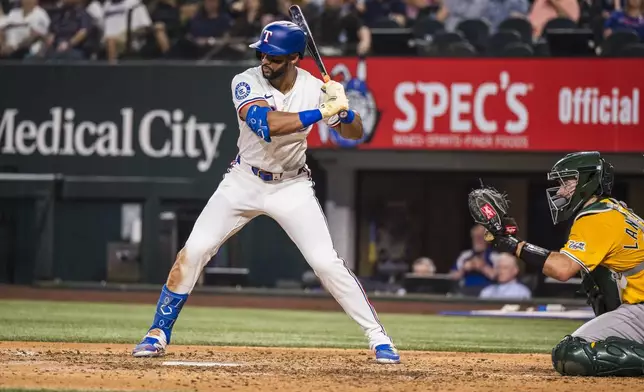 Texas Rangers' Leody Taveras bats against the Athletics during the seventh inning of a baseball game Tuesday, April 29, 2025, in Arlington, Texas. (AP Photo/Jessica Tobias)