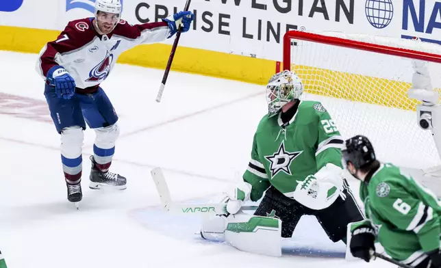 Colorado Avalanche defenseman Devon Toews (7) celebrates scoring past Dallas Stars goaltender Jake Oettinger (29) during a first-round NHL hockey playoff game in Dallas, Saturday, April 19, 2025. (AP Photo/Gareth Patterson)