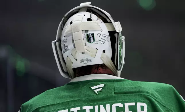 Dallas Stars goaltender Jake Oettinger (29) skates between periods during a first-round NHL hockey playoff game against the Colorado Avalanche in Dallas, Saturday, April 19, 2025. (AP Photo/Gareth Patterson)