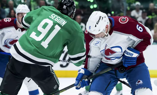 Dallas Stars center Tyler Seguin (91) and Colorado Avalanche defenseman Erik Johnson (6) collide while fighting for the puck during a first-round NHL hockey playoff game in Dallas, Saturday, April 19, 2025. (AP Photo/Gareth Patterson)