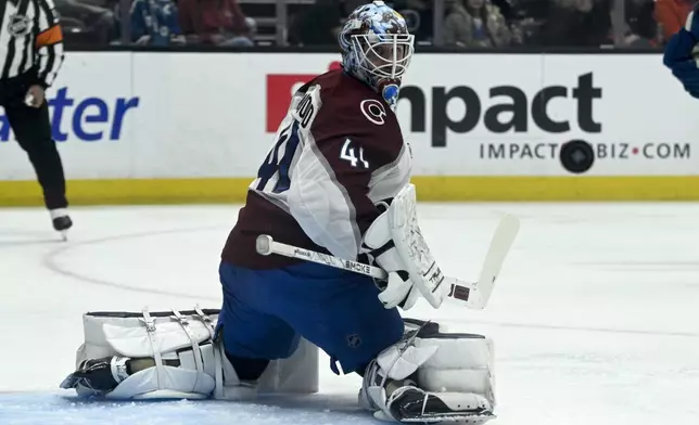 Colorado Avalanche goaltender Scott Wedgewood (41) looks back after deflecting a Anaheim Ducks shot during the first period of an NHL hockey game in Anaheim, Calif., Sunday, April 13, 2025. (AP Photo/Alex Gallardo)