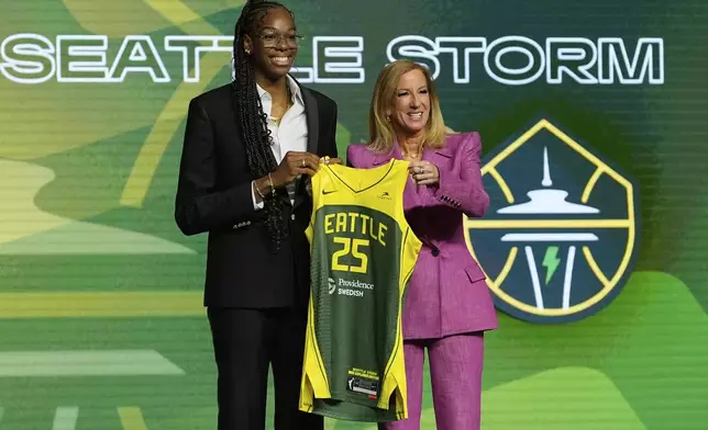 Dominique Malonga, left, poses with WNBA commissioner Cathy Engelbert after being selected second overall by the Seattle Storm during the first round of the WNBA basketball draft, Monday, April 14, 2025, in New York. (AP Photo/Pamela Smith)