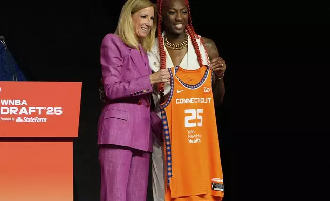 North Carolina State's Saniya Rivers, right, poses with WNBA commissioner Cathy Engelbert after being selected eighth overall by the Connecticut Sun during the first round of the WNBA basketball draft, Monday, April 14, 2025, in New York. (AP Photo/Pamela Smith)
