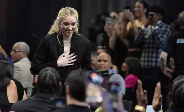 UConn's Paige Bueckers reacts after being selected first overall by the Dallas Wings during the first round of the WNBA basketball draft, Monday, April 14, 2025, in New York. (AP Photo/Pamela Smith)