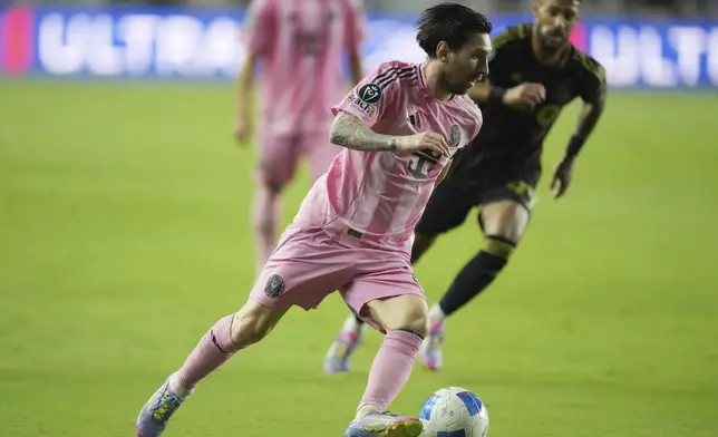 Inter Miami forward Lionel Messi (10) brings the ball up the field against the Los Angeles FC during the second half of a CONCACAF Nations League Quarterfinal Match at Chase Stadium, Wednesday, April 9, 2025 in Fort Lauderdale, Fla. (AP Photo/Jim Rassol)