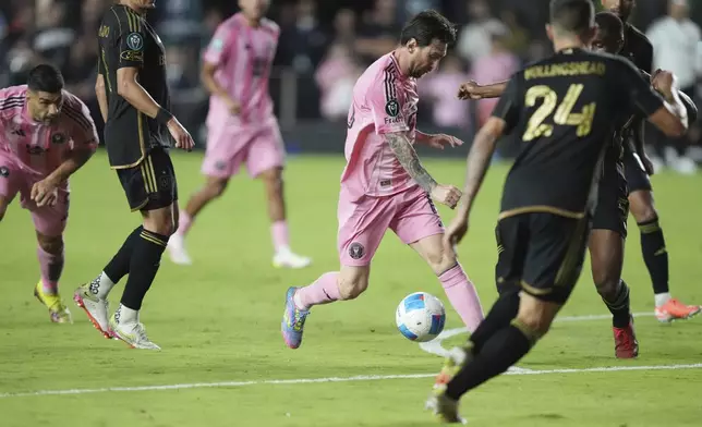 Inter Miami forward Lionel Messi (10) brings the ball up the field against the Los Angeles FC during the second half of a CONCACAF Nations League Quarterfinal Match at Chase Stadium, Wednesday, April 9, 2025 in Fort Lauderdale, Fla. (AP Photo/Jim Rassol)