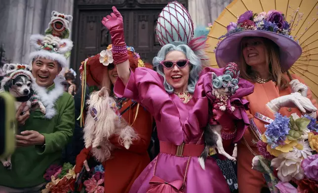 Revelers wearing decorated hats and costumes participate in the annual Easter Parade and Bonnet Festival in front of St. Patrick's Cathedral on Sunday, April 20, 2025, in New York. (AP Photo/Andres Kudacki)