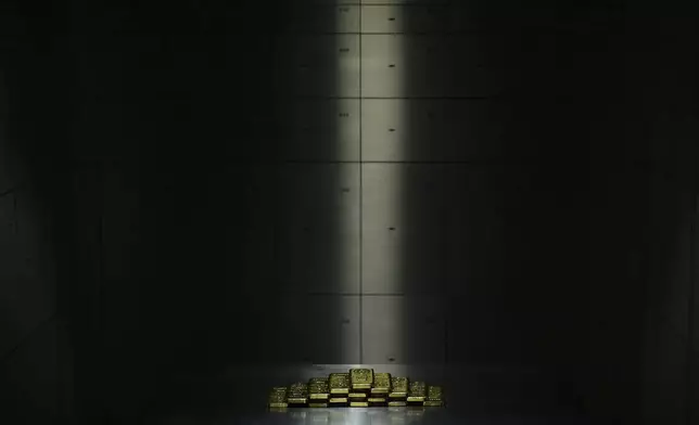 1 Kg gold bars of 999.9 purity are displayed in the safe deposit boxes room of Pro Aurum gold house in Munich, Germany, Friday, April 25, 2025. (AP Photo/Matthias Schrader)