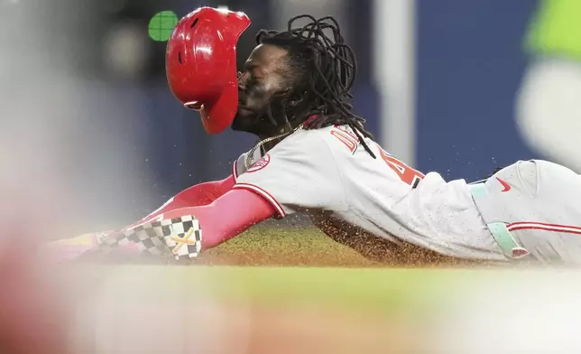 Cincinnati Reds' Elly De La Cruz steals second during the sixth inning of a baseball game against the Miami Marlins, Tuesday, April 22, 2025, in Miami. (AP Photo/Lynne Sladky)