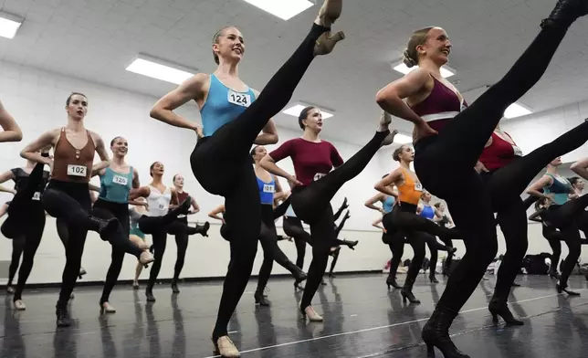 Dancers rehearse choreography before an audition for the Radio City Rockettes at Radio City Music Hall, Tuesday, April 22, 2025, in New York. (AP Photo/Julia Demaree Nikhinson)