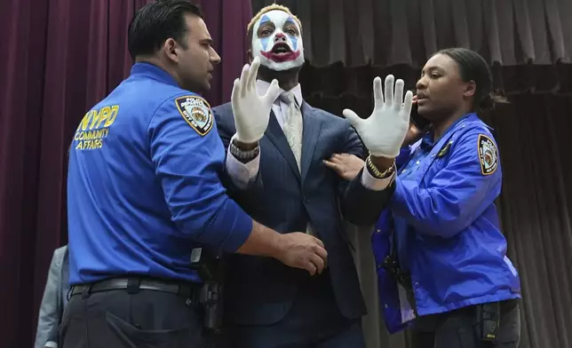 Paperboy Prince is removed from the New York City Mayoral Candidates Forum at Medgar Evers College Wednesday, April 23, 2025, in New York. (AP Photo/Frank Franklin II)