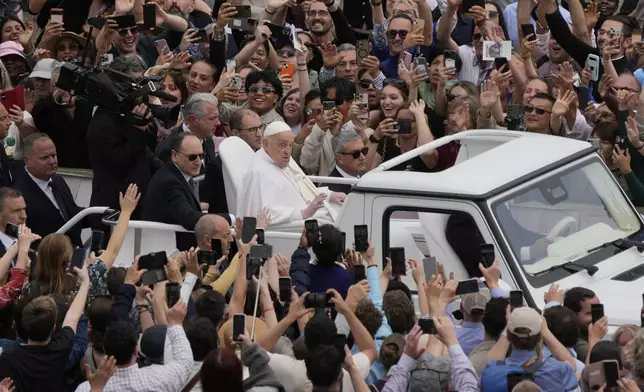 Pope Francis tours St. Peter's Square in his popemobile after bestowing the Urbi et Orbi (Latin for to the city and to the world) blessing at the end of the Easter mass presided over by Cardinal Angelo Comastri in St. Peter's Square at the Vatican Sunday, April 20, 2025.(AP Photo/Gregorio Borgia)