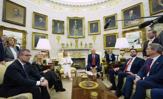 President Donald Trump meets with Italy's Prime Minister Giorgia Meloni in the Oval Office of the White House, Thursday, April 17, 2025, in Washington. (AP Photo/Alex Brandon)