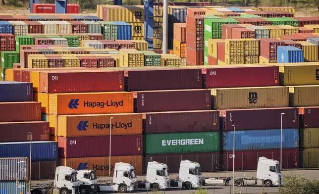 Containers are stored at a container terminal in Duisburg, Germany, the day after President Trump announced new tariffs for the EU and the rest of the world, Thursday, April 3, 2025. (AP Photo/Martin Meissner)