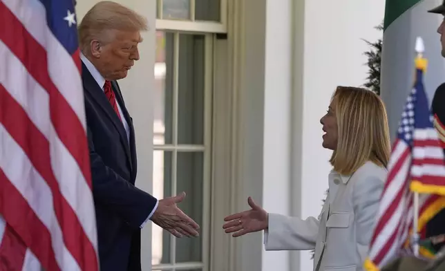President Donald Trump greets Italy's Prime Minister Giorgia Meloni at the White House, Thursday, April 17, 2025, in Washington. (AP Photo/Alex Brandon)