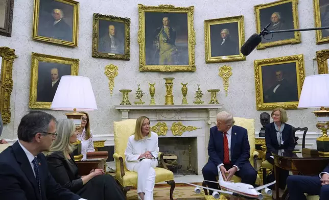 President Donald Trump meets with Italy's Prime Minister Giorgia Meloni in the Oval Office of the White House, Thursday, April 17, 2025, in Washington. (AP Photo/Alex Brandon)