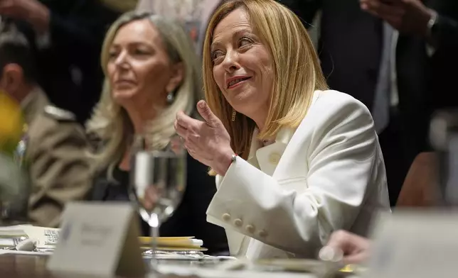 Italy's Prime Minister Giorgia Meloni speaks before a luncheon with President Donald Trump in the Cabinet Room of the White House, Thursday, April 17, 2025, in Washington. (AP Photo/Alex Brandon)