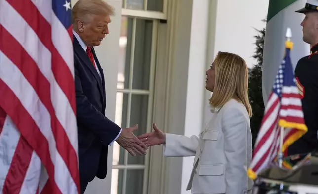 President Donald Trump greets Italy's Prime Minister Giorgia Meloni at the White House, Thursday, April 17, 2025, in Washington. (AP Photo/Alex Brandon)