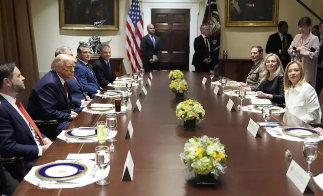 President Donald Trump and Italy's Prime Minister Giorgia Meloni are seated before lunch in the Cabinet Room of the White House, Thursday, April 17, 2025, in Washington. (AP Photo/Alex Brandon)